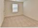 Bright bedroom featuring neutral carpet, a window and a closet at 2761 Sandy Rd, Conyers, GA 30013