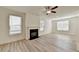 Cozy living room with a fireplace and an adjacent window-filled space at 2761 Sandy Rd, Conyers, GA 30013