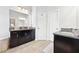 Bathroom featuring dual vanities with granite countertops and modern lighting at 3185 Quinn Pl, Atlanta, GA 30341