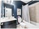 Bathroom with tub and shower combo, vanity, and modern fixtures at 3185 Quinn Pl, Atlanta, GA 30341