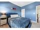 Comfortable bedroom featuring blue walls, plush carpet, and a cozy bed at 3185 Quinn Pl, Atlanta, GA 30341