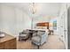 Bright bedroom with vaulted ceiling, chandelier, and comfortable sitting area at 3185 Quinn Pl, Atlanta, GA 30341