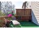 Relaxing deck features a lounger, plants, and a view of the surrounding trees at 3185 Quinn Pl, Atlanta, GA 30341