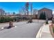 A gated entrance to a residential community with brick pillars and manicured landscaping at 3185 Quinn Pl, Atlanta, GA 30341