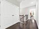 Upstairs hallway with hardwood floors and view into bedroom at 3185 Quinn Pl, Atlanta, GA 30341