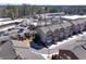 An aerial view of townhomes with brick facades, garages, and landscaped surroundings at 3185 Quinn Pl, Atlanta, GA 30341