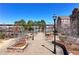 A walkway with brick pavers, street lamps, and landscaping within a townhome community at 3185 Quinn Pl, Atlanta, GA 30341