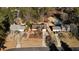 Aerial view of a well-maintained single-Gathering home with an in-ground pool nestled among mature trees at 541 Buckingham Cir, Marietta, GA 30066