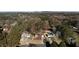 Aerial view of 541 Buckingham showcasing home and neighborhood surrounded by mature trees and lush landscaping at 541 Buckingham Cir, Marietta, GA 30066