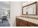 Bathroom vanity with granite countertop, dark wood cabinets and a white sink at 541 Buckingham Cir, Marietta, GA 30066