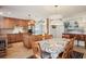 Bright dining area with a view to the kitchen featuring wood cabinets and stainless steel appliances at 541 Buckingham Cir, Marietta, GA 30066