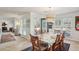 Dining area with a large table, rug, and lots of natural light coming from the windows at 541 Buckingham Cir, Marietta, GA 30066