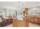 Open kitchen and dining area with granite countertops, an island and bright windows at 541 Buckingham Cir, Marietta, GA 30066