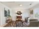 Another view of the living room featuring a zebra rug, comfortable seating, and unique décor at 541 Buckingham Cir, Marietta, GA 30066