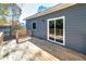 Exterior view of a wooden deck with a sliding door and a small yard, perfect for outdoor enjoyment at 944 Woodland Se Ave, Atlanta, GA 30316