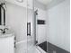 This modern bathroom features a glass shower enclosure with a built-in shower seat at 944 Woodland Se Ave, Atlanta, GA 30316