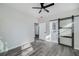 This bedroom has a ceiling fan and a sliding door leading to the bathroom at 944 Woodland Se Ave, Atlanta, GA 30316