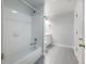 Bright bathroom with a white tiled shower and a vanity with white cabinets at 1430 Watercove Ln, Lawrenceville, GA 30043