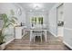 Formal dining room with modern lighting, neutral paint, and views of backyard at 1430 Watercove Ln, Lawrenceville, GA 30043