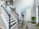 Grand foyer with staircase, tile flooring, neutral paint, and ample natural light at 1430 Watercove Ln, Lawrenceville, GA 30043