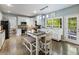 Bright kitchen with stainless appliances, center island, and access to outdoor patio at 1430 Watercove Ln, Lawrenceville, GA 30043