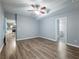 Open-concept living room with luxury vinyl plank flooring that connects to the kitchen and bathroom at 1430 Watercove Ln, Lawrenceville, GA 30043