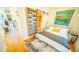 Stylish bedroom featuring a sliding barn door, a futon, and modern decor at 155 Mado Ln, Palmetto, GA 30268