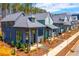 Charming row of modern homes with gray exteriors, metal roofs and landscaped yards at 155 Mado Ln, Palmetto, GA 30268