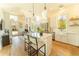 Stylish kitchen with modern island, bar stool seating, and stainless steel appliances at 155 Mado Ln, Palmetto, GA 30268