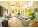 Bright living room boasts high ceilings, large windows and stylish contemporary furniture at 155 Mado Ln, Palmetto, GA 30268