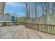 Spacious wooden deck with a view of the surrounding trees, perfect for outdoor entertaining at 1830 Jan Hill Ne Ln, Atlanta, GA 30329