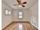 Bright bedroom with hardwood floors, a ceiling fan, and a window at 1830 Jan Hill Ne Ln, Atlanta, GA 30329