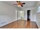 A bright bedroom with hardwood flooring, a ceiling fan, a closet, and an ensuite bathroom at 1830 Jan Hill Ne Ln, Atlanta, GA 30329