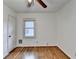Bright bedroom featuring hardwood floors, a ceiling fan, and a window offering natural light at 1830 Jan Hill Ne Ln, Atlanta, GA 30329