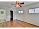 Bedroom featuring wood floors, access to an ensuite bathroom, and a closet with sliding doors at 1830 Jan Hill Ne Ln, Atlanta, GA 30329