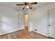 This bedroom offers hardwood flooring, a ceiling fan, and neutral walls at 1830 Jan Hill Ne Ln, Atlanta, GA 30329