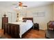 A well lit bedroom boasts hardwood floors, a ceiling fan and a closet for maximum storage at 1830 Jan Hill Ne Ln, Atlanta, GA 30329