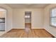 Dining room with wood flooring, trim, neutral walls and view to kitchen at 1830 Jan Hill Ne Ln, Atlanta, GA 30329