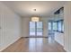Cozy dining room featuring wood paneling, wood flooring, and a glass door leading to deck at 1830 Jan Hill Ne Ln, Atlanta, GA 30329