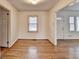 Dining room with wood floors, trim, neutral walls and view to entry and living room at 1830 Jan Hill Ne Ln, Atlanta, GA 30329