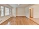 Bright, open room with hardwood floors, large windows and white walls, ready for personalized decor at 1830 Jan Hill Ne Ln, Atlanta, GA 30329