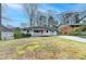 Charming single-story home with a welcoming front porch and well-maintained lawn at 1830 Jan Hill Ne Ln, Atlanta, GA 30329