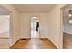 Hallway featuring neutral walls, wood floors and trim and doorways to rooms at 1830 Jan Hill Ne Ln, Atlanta, GA 30329