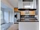 Kitchen features stainless steel appliances, granite counters, and opens to the living area at 1830 Jan Hill Ne Ln, Atlanta, GA 30329