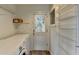 Functional laundry room with a washer, dryer, and convenient shelving at 1830 Jan Hill Ne Ln, Atlanta, GA 30329