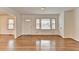 Open living room with hardwood floors and windows at 1830 Jan Hill Ne Ln, Atlanta, GA 30329