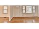 Bright living space featuring light hardwood floors, white walls and trim with windows to the front porch at 1830 Jan Hill Ne Ln, Atlanta, GA 30329