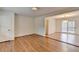 Open-concept living room with hardwood floors and access to the back deck at 1830 Jan Hill Ne Ln, Atlanta, GA 30329