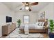 Stylish main bedroom featuring a tv, natural light and modern decor at 1830 Jan Hill Ne Ln, Atlanta, GA 30329
