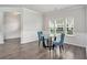 Bright dining area with wood floors, classic wainscoting and modern chairs at 3901 Shelleydale Dr, Powder Springs, GA 30127